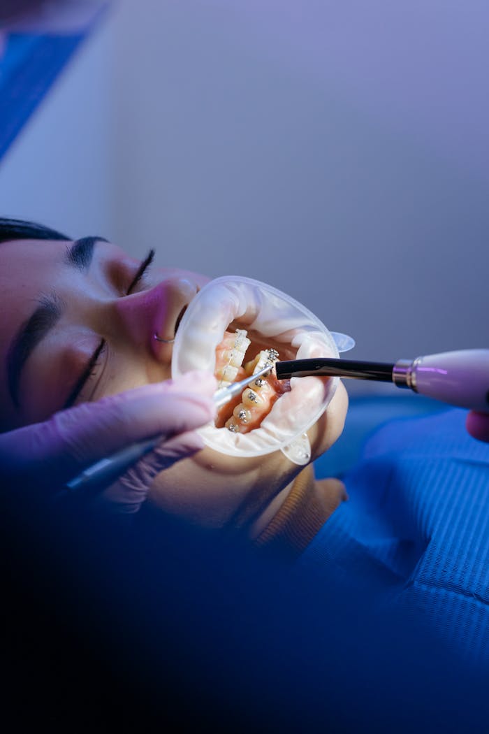 Crafting Captivating Headlines: Your awesome post title goes here Patient receiving orthodontic treatment in a modern dental clinic, showcasing dental care techniques.